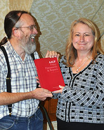 President Dixon presents David Gruber with the David F. Gruber Leadership Development Award.